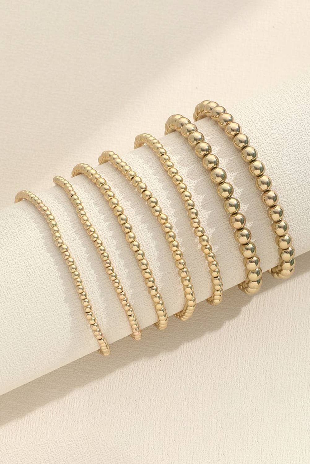 7 pc Beaded Gold stack bracelets